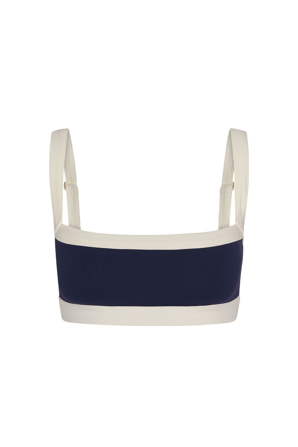 Front view of Outpost Bra with square neckline, midnight navy center and ivory trim, adjustable straps on white